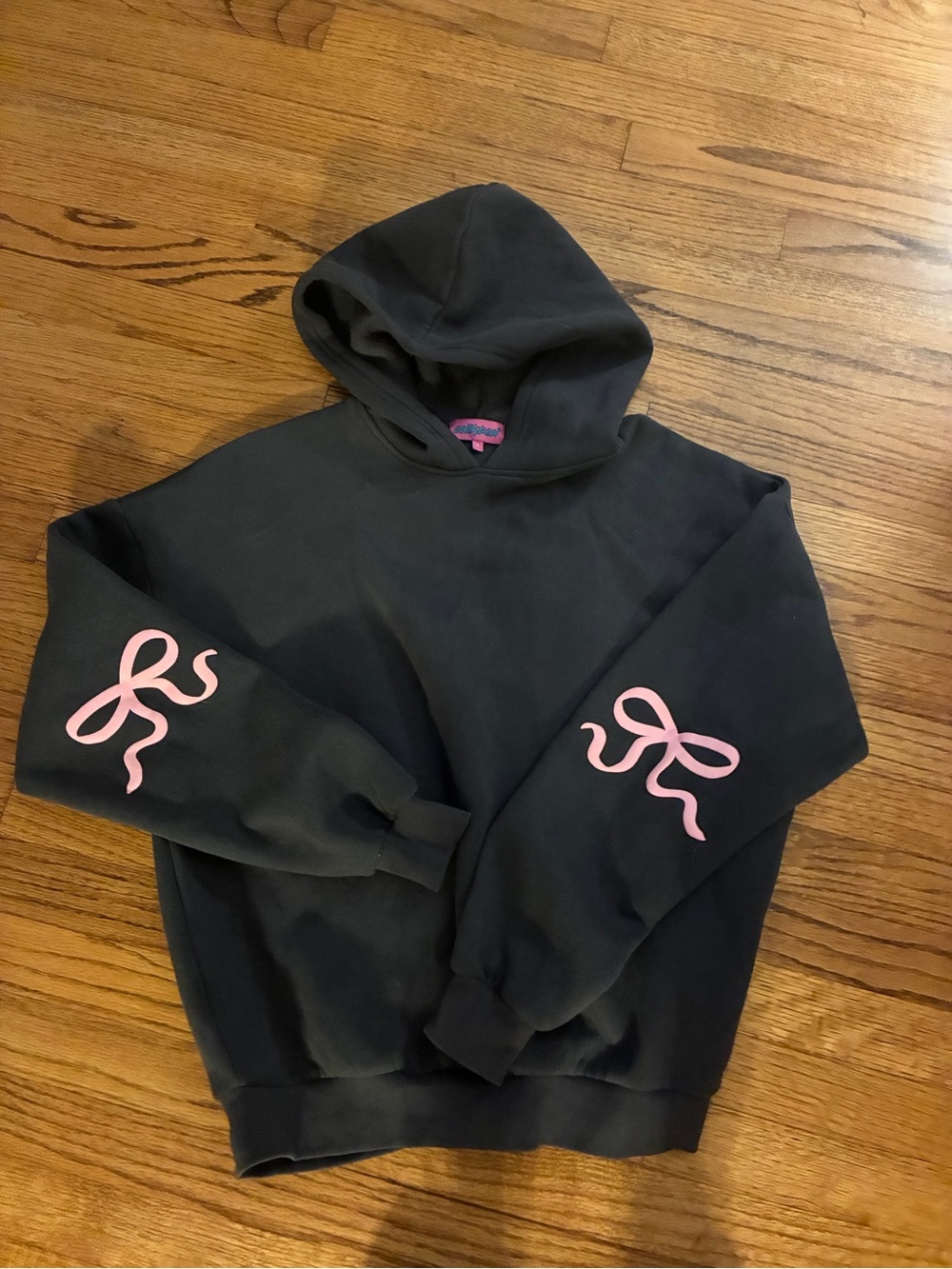 Edikted Black Crewneck Sweatshirt with Pink Bow Sleeve Accents